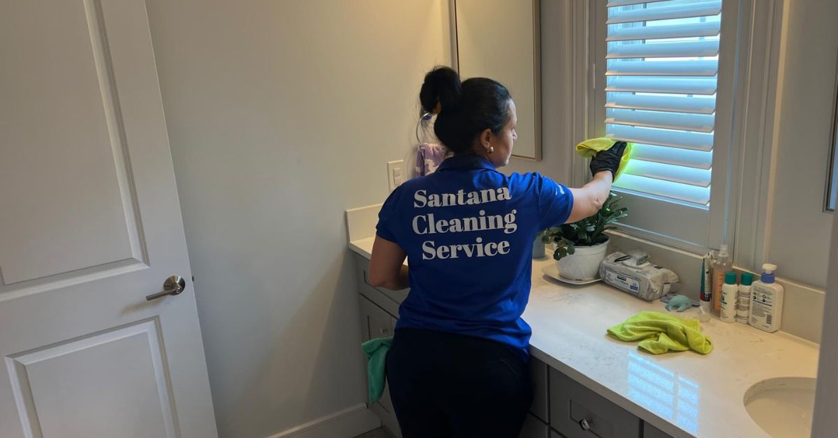 Worker cleaning house windows in New Jersey